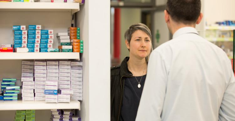 lady at a pharmacy counter