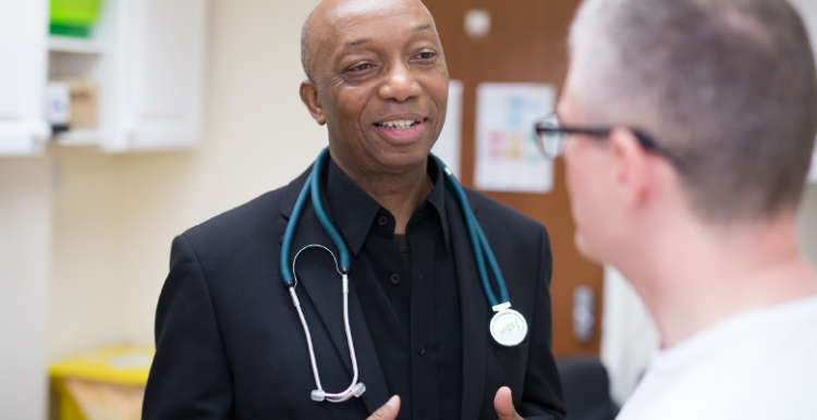 A doctor speaking to a patient