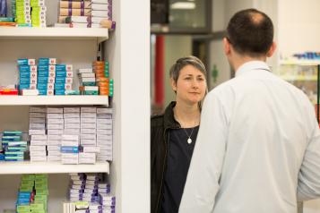 lady at a pharmacy counter