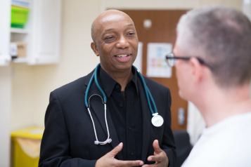 A doctor speaking to a patient